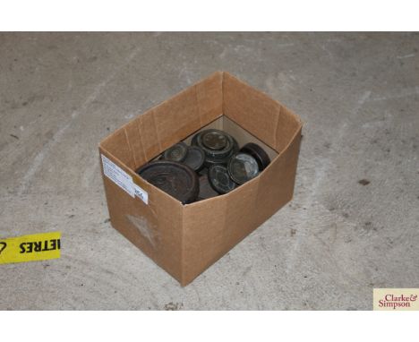 A box of miscellaneous shop scale weights, various sizes