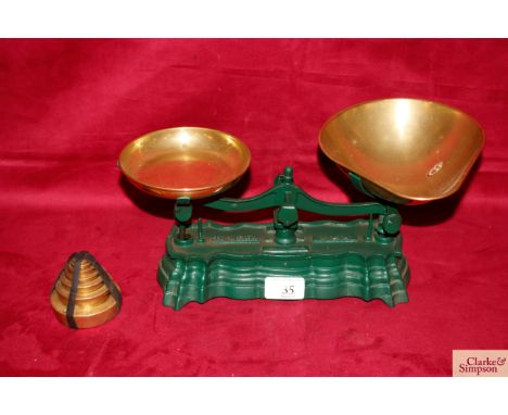 A set of early kitchen scales with brass pans and weights 