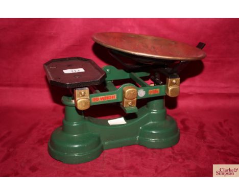 A set of cast iron and brass shop scales to weigh 7lbs with copper tray and inspectors stamp