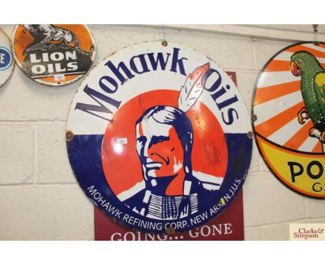 A large circular enamel sign for "Mohawk Oils", 30"dia.
