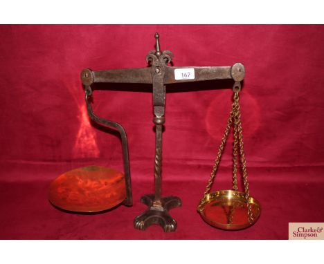 A set of iron beam scales with brass pans, circa.1860