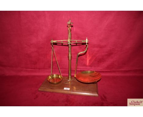 A set of W H West of Norwich, beam scales with brass pans, circa. late 19th Century