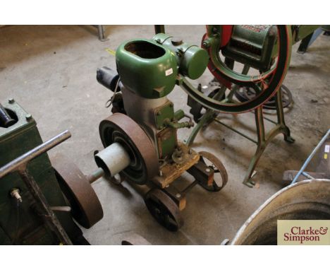 A Wolseley 1½HP stationery engine on trolley with cast iron wheels