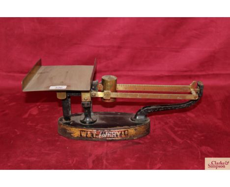 A WT Avery Ltd set of brass and iron counter scales with sliding brass counterweight and brass tray