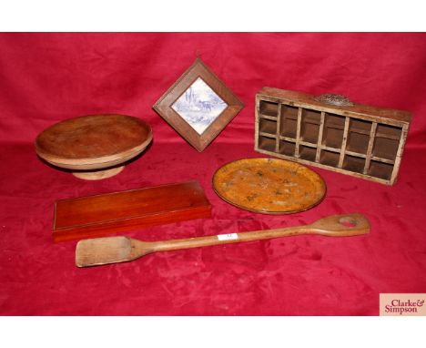 Various items to include a large elm cake stand; a framed 19th Century blue and white tile; a Victorian hardware store sectio