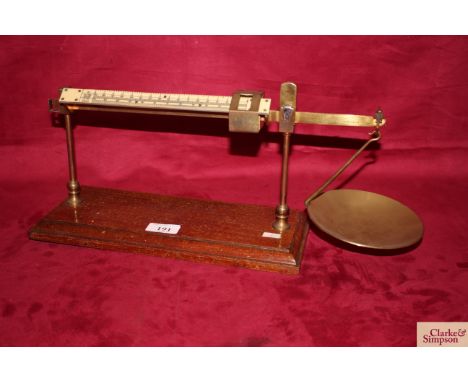 A set of brass estimating scales set on mahogany plinth by W T Avery Ltd, with sliding faux ivory scale, marked ounces per do