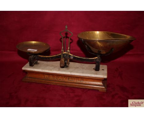 A set of W T Avery Ltd shop scales on marble and wooden plinth with brass tray and scoop