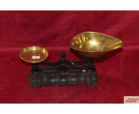 A set of cast iron counter scales to weigh 7lbs with brass weight tray and brass scoop,&nbsp; (class 2, Made in France)