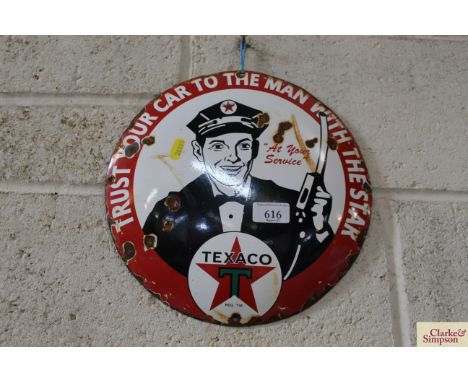 A circular enamel advertising sign for "Texaco", 12" dia.