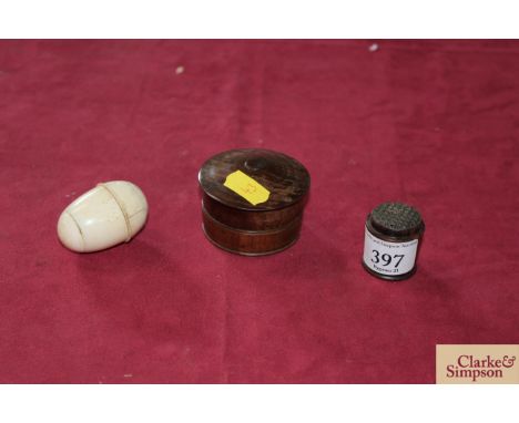 A Regency bone egg form nutmeg grater; a mid 19th Century rosewood nutmeg grater and a 18th Century walnut cased pocket paper
