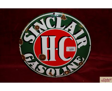 A circular enamel advertising sign for "Sinclair Gasoline", 11½" dia.