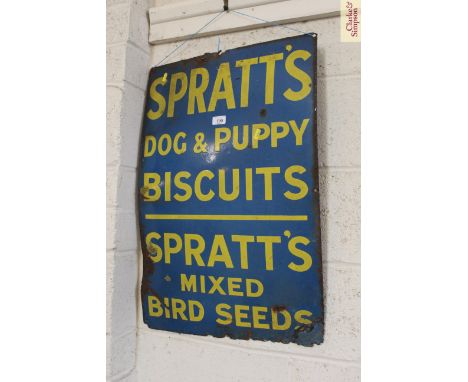 An enamel advertising sign for Spratts Dog and Puppy Biscuits and Spratts Mixed Bird Seeds, 30" x 20"