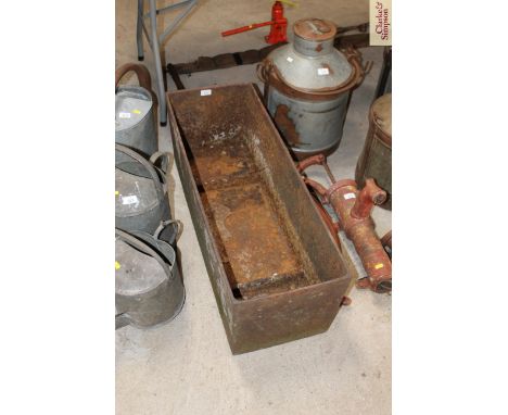 A cast iron trough / planter