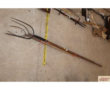 Two pitch forks and a small pitch fork (possibly a childs)