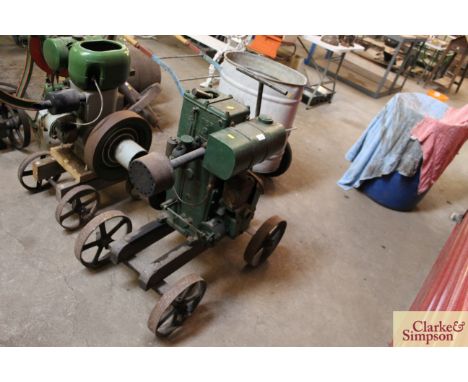 A Lister 1½HP stationery engine on cast iron wheel trolley