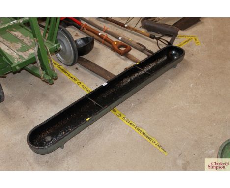 A long cast iron feeding trough 