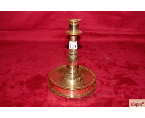 A 17th Century brass candlestick 