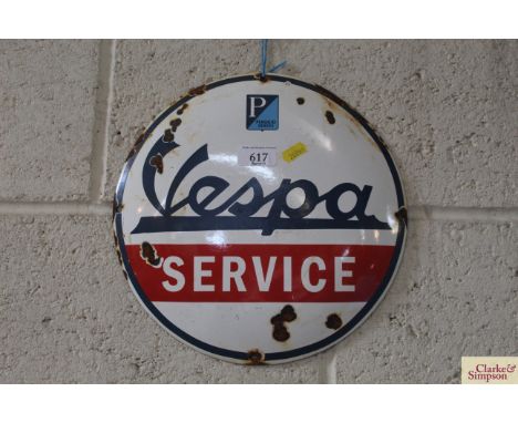 A circular enamel advertising sign for "Vespa", 12" dia. 