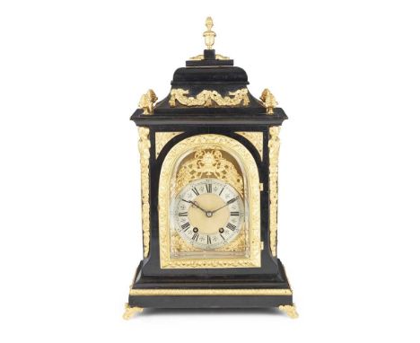 VICTORIAN EBONISED AND GILT METAL MOUNTED BRACKET CLOCK  LATE 19TH CENTURY the arched gilt dial with silvered chapter ring wi