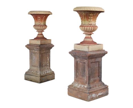 PAIR OF SCOTTISH FIRECLAY URNS AND PEDESTALS 19TH CENTURY the urns of campana form with lappet moulded everted rims and bodie