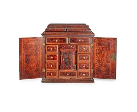 Y NORTH ITALIAN ALTO ADIGE CYPRESS AND CEDAR WOOD AND POKER-WORK TABLE CABINET EARLY 17TH CENTURY the moulded caddy-type top 