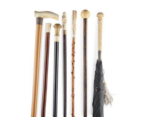 Y GROUP OF WALKING STICKS AND CANES 19TH/ EARLY 20TH CENTURY to include a stick with an ivory ball pommel, 89cm long; a stick