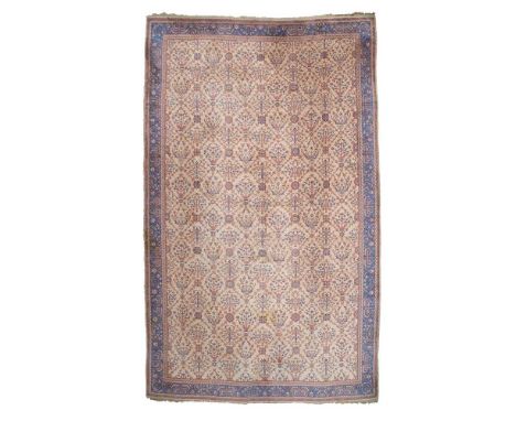 THE DYERS' COMPANY USHAK CARPET WEST ANATOLIA, EARLY 20TH CENTURY the camel field with allover palmette and foliate vine latt