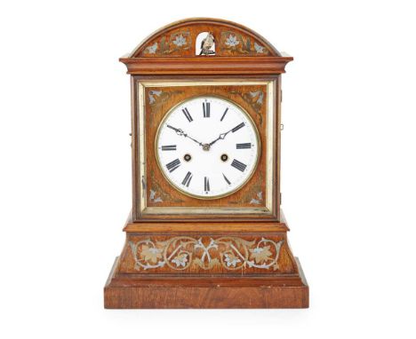 GERMAN/ AUSTRIAN WALNUT, BRASS AND PEWTER CUCKOO CLOCK 19TH CENTURY the round white enamel dial with Roman numerals, the brea
