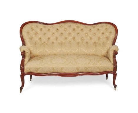 VICTORIAN MAHOGANY FRAMED SOFA 19TH CENTURY the serpentine button-upholstered back above a padded serpentine seat flanked by 