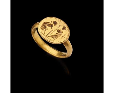 BYZANTINE GOLD FINGER RING EASTERN MEDITERRANEAN, 6TH CENTURY A.D. cast gold, the face with an engraved scene from the life o