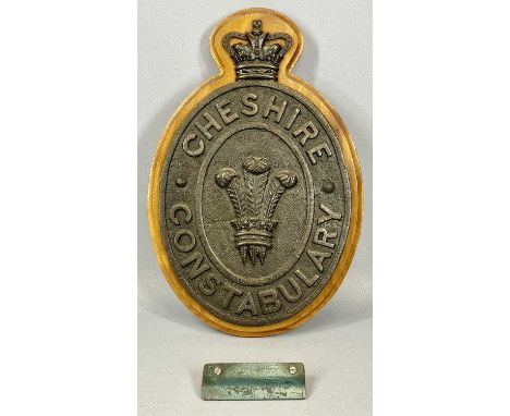 A VINTAGE CAST IRON WALL PLAQUE, Cheshire Constabulary, mounted on a mahogany back plate, 48 (h) x 32cms (w)