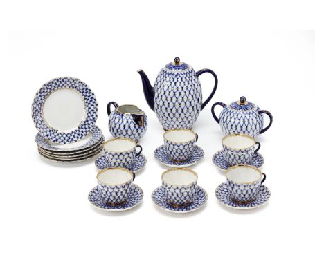 A RUSSIAN PORCELAIN COFFEE SERVICE
In cobalt net pattern with gilt highlights, comprising: a teapot; cream jug; sugar bowl; s