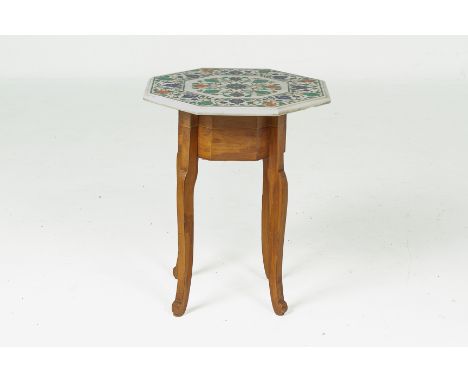 AN INDIAN SIDE TABLE WITH OCTAGONAL MARBLE TOP
The marble top decorated with scrolling foliate centre and border, with interi