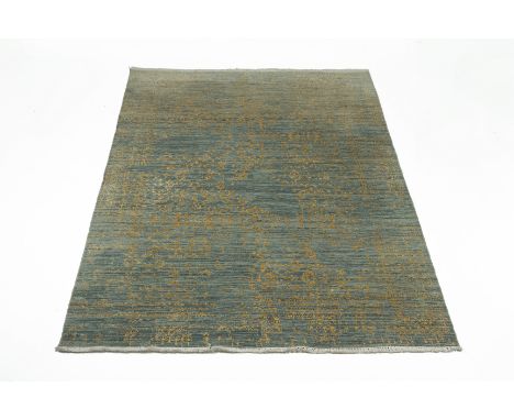 A CONTEMPORARY WOOL RUG The central field of scrolling foliate design within further foliate borders 283cm x 185cm Condition: