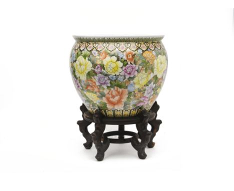 A PORCELAIN JARDINIERE ON STAND
With foliate decoration, on a hardwood base
35H x 42 diameter cm
Condition: For a condition r