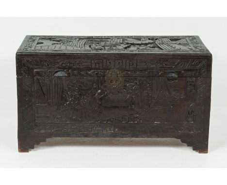A CARVED WOOD CAMPHOR LINED CHEST
Carved with figures in various landscapes, on stepped bracket feet
54cm high x 101cm wide  