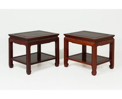 A PAIR OF CHINESE ROSEWOOD SIDE TABLES
The supports with moulded edge and joined by an under tier
51cm high x 56 cm wide x 46