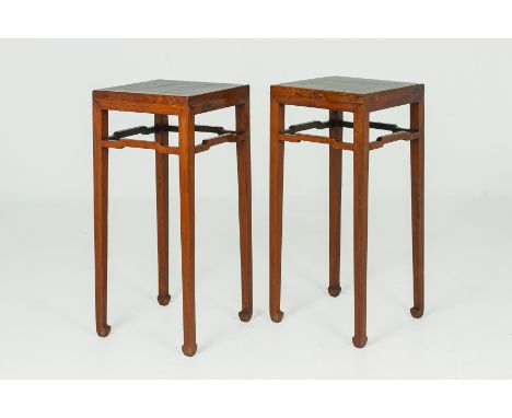 A PAIR OF CHINESE ELM SQUARE SIDE TABLES
The square tapering supports joined by humpback stretcher rails, on hoof feet, with 