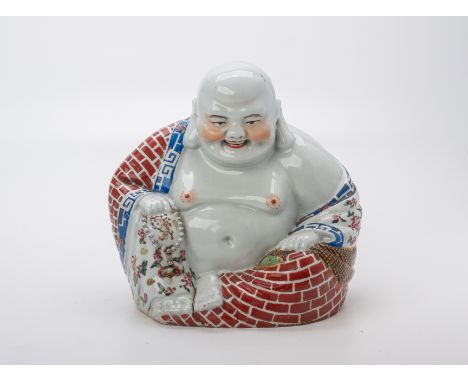 A FAMILLE ROSE PORCELAIN MODEL OF BUDAI
Typically modelled, with brick work robe, impressed mark to base
22cm tall
Condition: