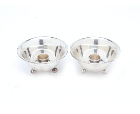 A PAIR OF MEXICAN STERLING SILVER CANDLESTICKS
By Avalos, of bowl form on three ball feet, with central nozzle, marked to bas
