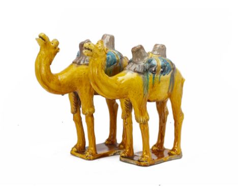 A PAIR OF SANCAI GLAZED MODELS OF CAMELS
In the Tang style; together with a smaller model of a horse
Camels 38cm high
Conditi