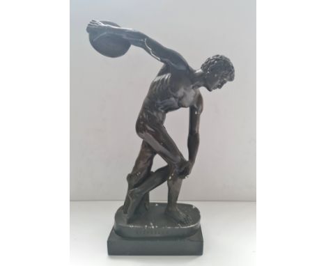 A plaster figure of Discobolus painted bronze height 49 cm.