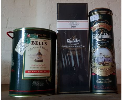 A Bells Extra Special Old Scotch Whisky, a limited Centenary edition Glenfiddich scotch whisky and a special reserve Glenfidd