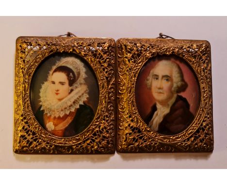 Two late 19th century portrait miniatures on ivory - one of a lady with ornate lace headdress and ruff the other a gentleman 