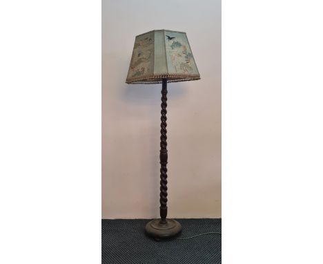 A oak barley twist standard lamp and shade.