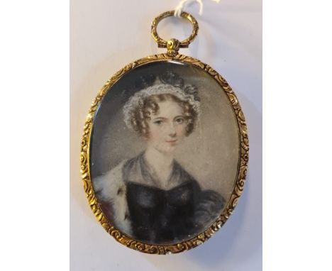 A 19th century portrait miniature on ivory of a lady with ermine fur top in gilt metal frame and back with hair locket. This 