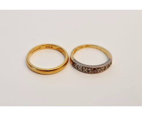 A rubbed marked wedding band, ring size O, and a rubbed 18ct mark half eternity diamond ring, (one stone deficit), ring size 