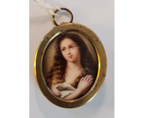 A portrait miniature on ceramic disk of a young woman praying in oval picture frame style metal frame.