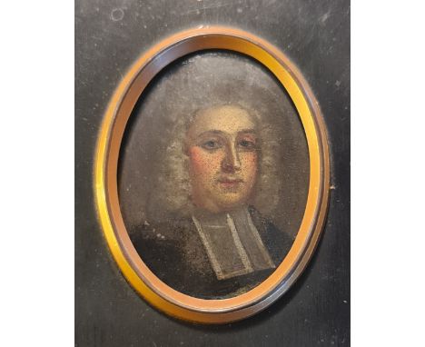 A portrait miniature of a clergyman on copper oval in wood frame.
