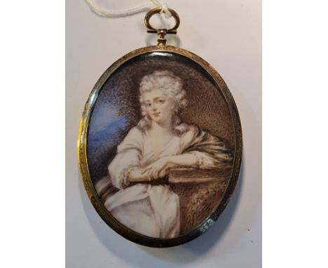 A 19th century portrait miniature on ivory of a seated lady resting on a plinth in silver coloured metal oval frame with blue